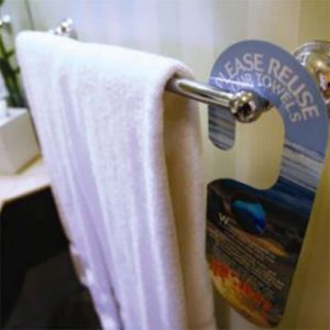 Stop listening to donors | image of hand towel on rack with "please reuse" sign